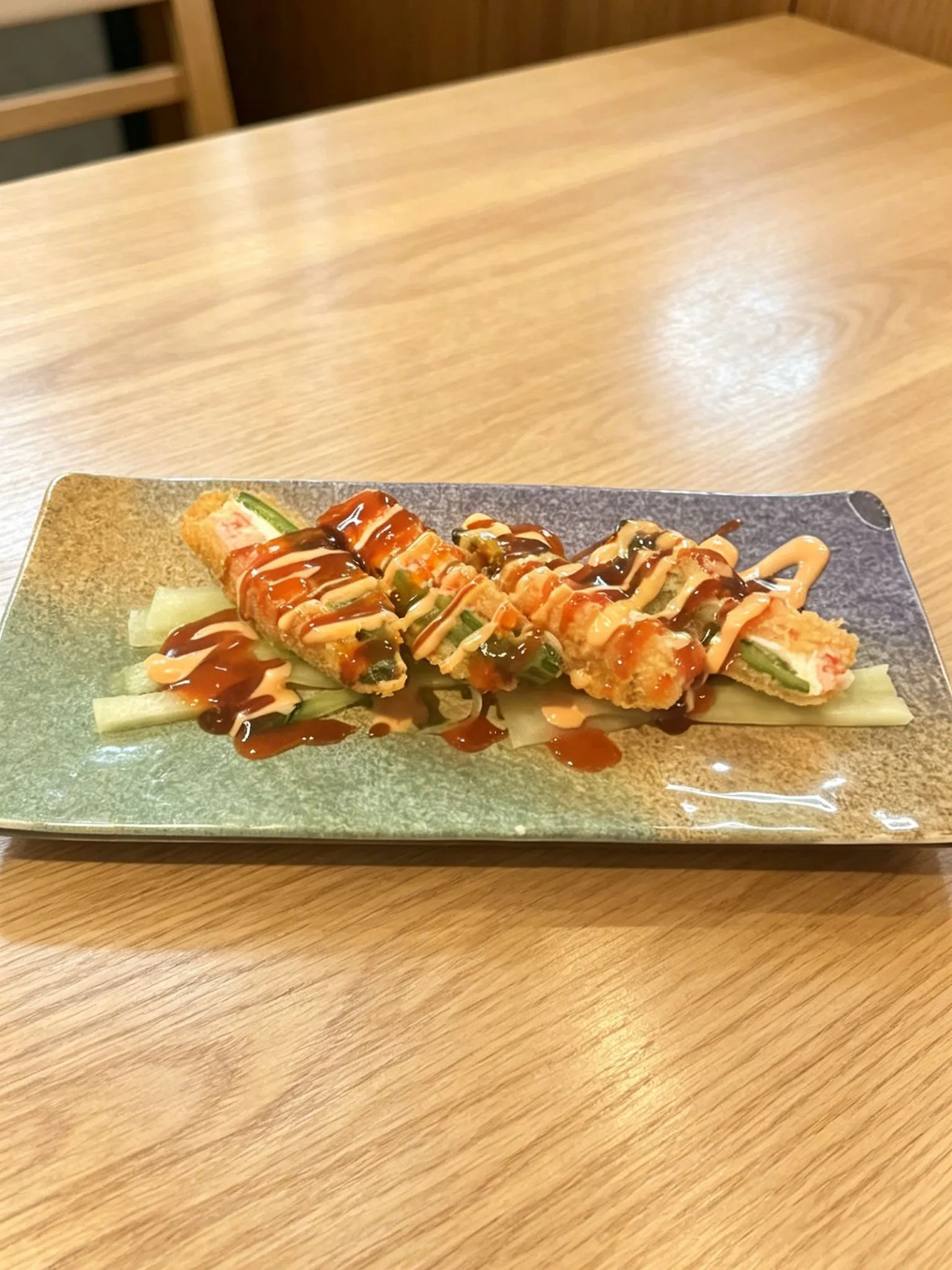 Fried sushi rolls with creamy and savory sauces at LA Sushi And Hibachi, a Japanese Restaurant in Santa Fe
